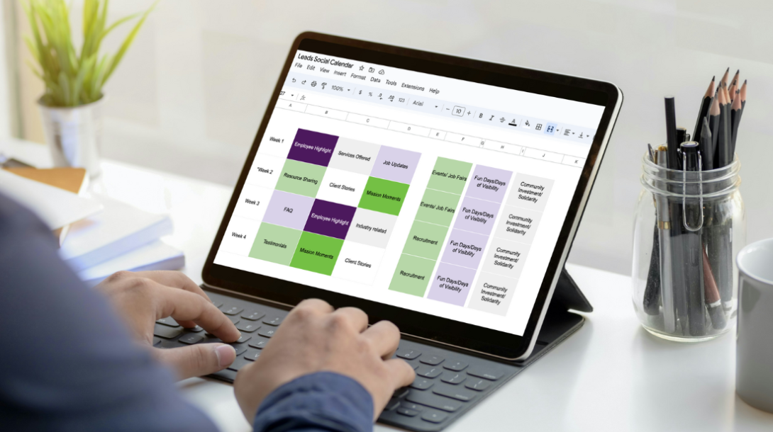 Image of an individual typing on an iPad where Leads' content calendar is displayed